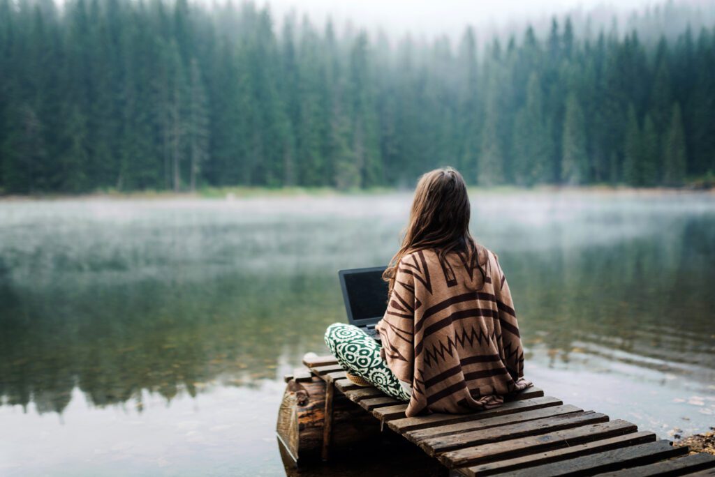 A digital nomad vacations at a rental in the woods.